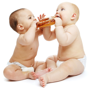 Babies eating a roll